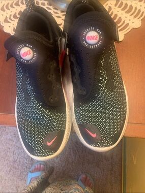 Nike women’s Black Knit Slip-On Sneakers with Mint Speckle and Pink Swoosh